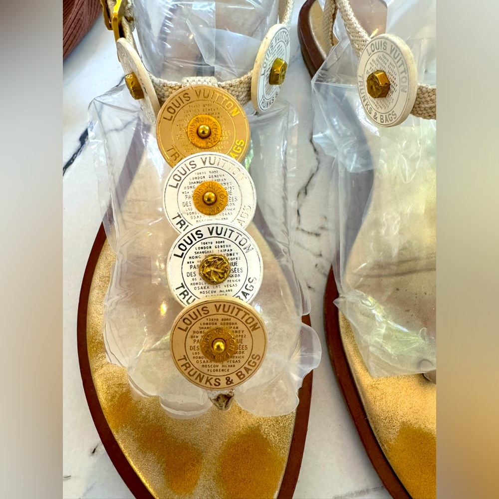 LOUIS VUITTON gold and white coin sandals.